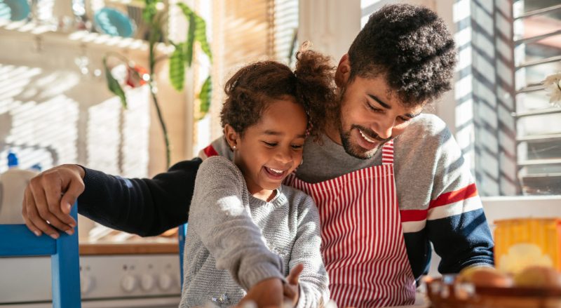 dad and child cooking together
